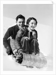 1920s 1930s smiling couple man and woman on toboggan in winter by Anonymous