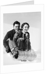 1920s 1930s smiling couple man and woman on toboggan in winter by Anonymous