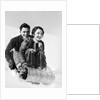 1920s 1930s smiling couple man and woman on toboggan in winter by Anonymous