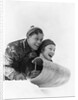 1930s couple on toboggan laughing by Anonymous