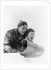 1930s couple on toboggan laughing by Anonymous