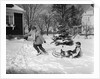1950s woman mother pulling boy son on sled in winter by Anonymous
