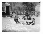 1950s woman mother pulling boy son on sled in winter by Anonymous