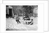 1950s woman mother pulling boy son on sled in winter by Anonymous