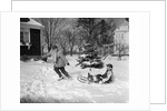 1950s woman mother pulling boy son on sled in winter by Anonymous