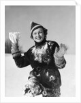 1930s smiling young woman covered in snow throwing piece of snow squinting looking at camera by Anonymous