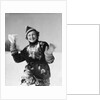 1930s smiling young woman covered in snow throwing piece of snow squinting looking at camera by Anonymous