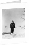 1930s woman holding ski poles skiing in snow by Anonymous