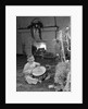 1950s little boy playing toy drum by christmas tree and fireplace looking at camera by Anonymous