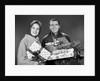 1960s smiling couple man and woman holding wrapped christmas presents and packages by Anonymous