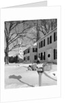 1960s woman walking to rural mailbox in front of home in snow piled with christmas packages by Anonymous