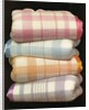 Vintage illustration of four stacked wool blankets by Anonymous