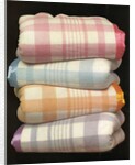 Vintage illustration of four stacked wool blankets by Anonymous