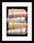 Vintage illustration of four stacked wool blankets by Anonymous