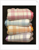 Vintage illustration of four stacked wool blankets by Anonymous