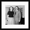 Young newlyweds smile for a portrait, ca. 1956. by Anonymous