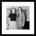 Young newlyweds smile for a portrait, ca. 1956. by Anonymous