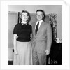 Young newlyweds smile for a portrait, ca. 1956. by Anonymous