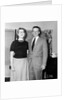 Young newlyweds smile for a portrait, ca. 1956. by Anonymous