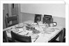 Jesus watches over the dinner table, ca. 1956. by Anonymous