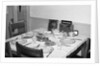 Jesus watches over the dinner table, ca. 1956. by Anonymous