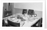 Jesus watches over the dinner table, ca. 1956. by Anonymous