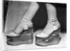Woman wearing aquarium wedged shoes by Anonymous
