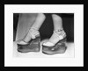 Woman wearing aquarium wedged shoes by Anonymous
