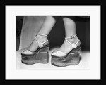Woman wearing aquarium wedged shoes by Anonymous
