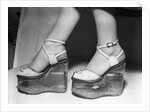 Woman wearing aquarium wedged shoes by Anonymous