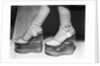 Woman wearing aquarium wedged shoes by Anonymous