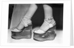 Woman wearing aquarium wedged shoes by Anonymous
