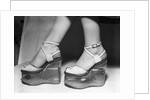 Woman wearing aquarium wedged shoes by Anonymous