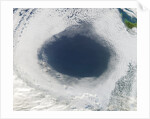 Cloud hole caused by intense high pressure system by Anonymous