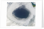 Cloud hole caused by intense high pressure system by Anonymous