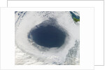 Cloud hole caused by intense high pressure system by Anonymous