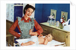 1940s Mother with Her Baby on a Changing Table in a Nursery. by Anonymous
