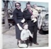 Young family dressed in the Sunday best, ca. 1960. by Anonymous