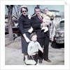 Young family dressed in the Sunday best, ca. 1960. by Anonymous