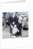 Young family dressed in the Sunday best, ca. 1960. by Anonymous