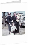 Young family dressed in the Sunday best, ca. 1960. by Anonymous