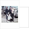 Young family dressed in the Sunday best, ca. 1960. by Anonymous