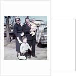 Young family dressed in the Sunday best, ca. 1960. by Anonymous
