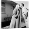 Young husband and wife kiss, ca. 1955. by Anonymous