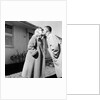 Young husband and wife kiss, ca. 1955. by Anonymous