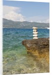 Stack of pebbles on cliff, Lumbarda, Korcula island, Croatia by Anonymous