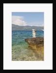Stack of pebbles on cliff, Lumbarda, Korcula island, Croatia by Anonymous