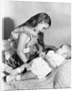 Big sister looks down on her baby brother, ca. 1948 by Anonymous