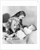 Big sister looks down on her baby brother, ca. 1948 by Anonymous