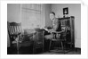 Harvard grad student studies as his desk, ca. 1938 by Anonymous